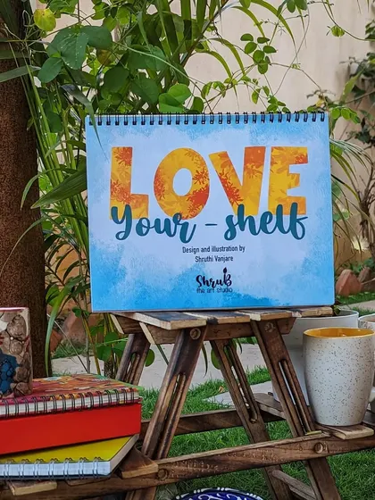 Here is my 2023 desk calendar, "Love Your-shelf." I designed and illustrated each month with a different theme, from books and plants to music and fitness, all arranged on cute shelves.