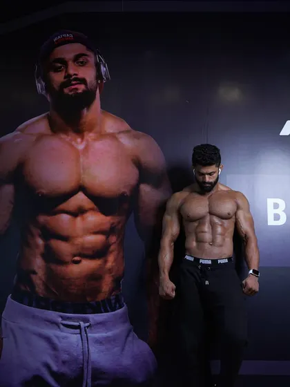 Standing next to my own image on the gym wall is a constant reminder of the standards I have to uphold. It's about being better than I was before.