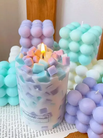 A playful collection of pastel-colored bubble candles and a unique chunk candle. These trendy designs are a fun way to decorate a shelf or desk.