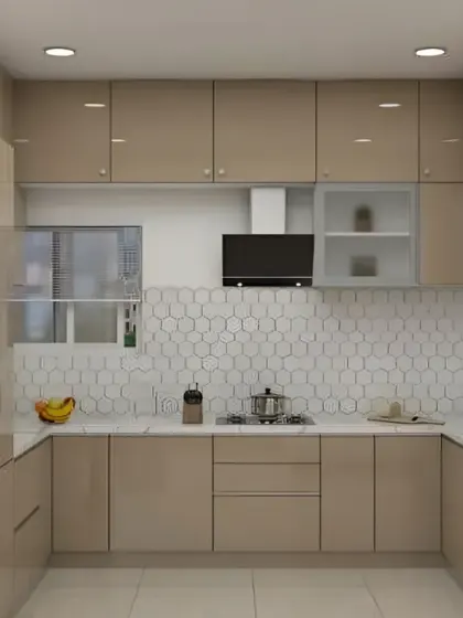 This U-shaped kitchen in a uniform beige high-gloss finish feels spacious and bright. The honeycomb tile backsplash adds a subtle modern pattern.