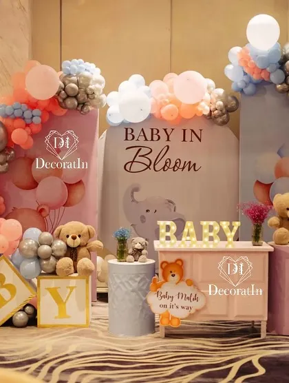 Another view of the "Baby in Bloom" setup, featuring "BABY" blocks and multiple teddy bears.