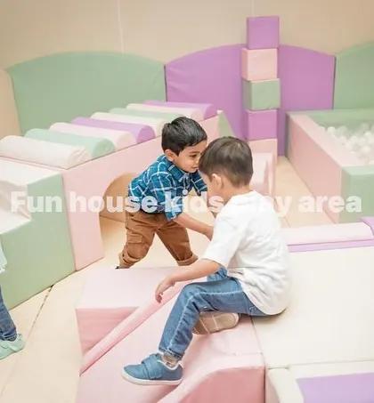 Kids navigating the pastel bridge and slide, encouraging active and social play.