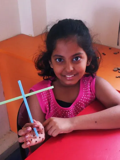 Another happy creator with her finished straw helicopter, ready for a test flight.