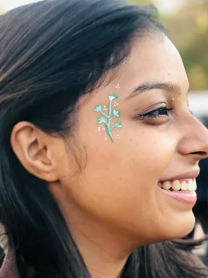 A sprig of leaves painted in a soft teal color, creating a lovely botanical accent.