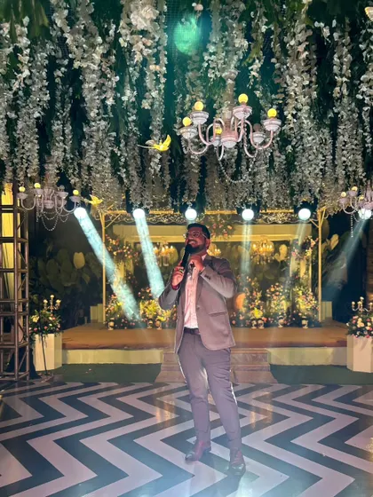 A dramatic shot on a beautifully lit stage. I love when the decor matches the energy of the event.