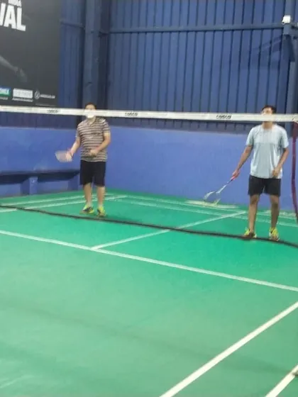 A doubles game underway on our green synthetic court. The clear court markings and quality nets ensure a professional playing experience for your hourly rental.