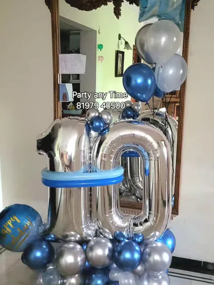 A 10th birthday balloon bouquet in blue and silver, perfect for a simple home celebration.