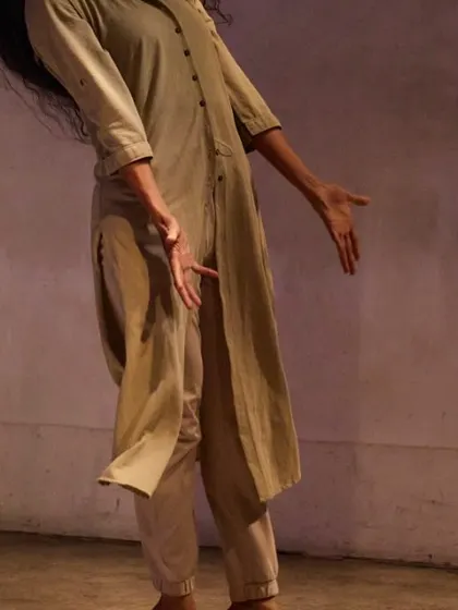 A shot from the "DANDYLION" performance, highlighting the flow and energy of the movement. The piece is a testament to the strength we can draw from the earth.