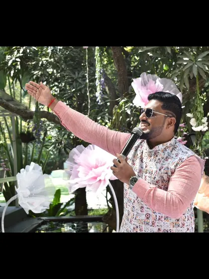 A wide shot of me addressing the crowd at a Haldi.