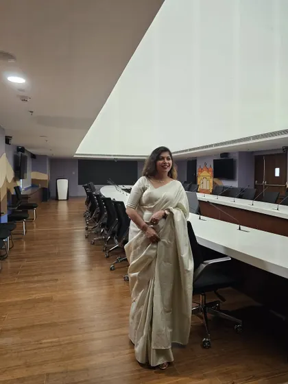 Another view of the expansive conference room at Uttarakhand Niwas. The unique ceiling light provides even, glare-free illumination, which is crucial for long meetings and presentations.
