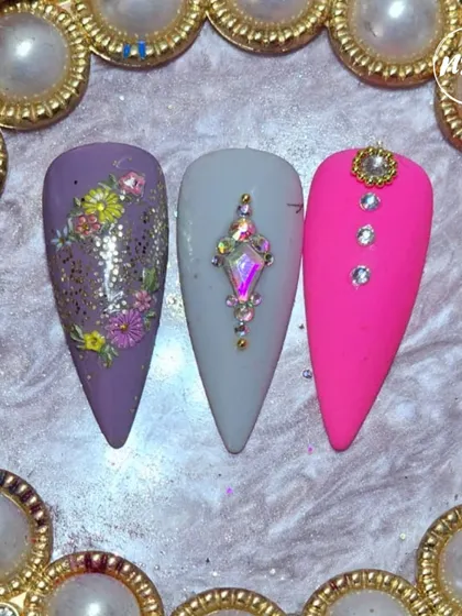 A trio of student designs, showing their versatility. From hand-painted florals to bold pink with rhinestones, their creativity is shining.