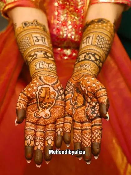 This baby shower design has the richness of a bridal piece, with full coverage on the hands and arms, celebrating the 'Maa' and the new life to come.