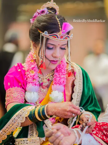 A candid shot during the wedding rituals. The makeup is waterproof and long-lasting, ensuring the bride looks perfect throughout the emotional and happy moments of her big day.