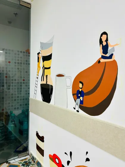 A detailed shot of the characters and coffee elements from the Dhruva Advisors mural, showing the clean lines and colorful palette.