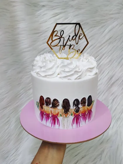 Another take on the bride and bridesmaids theme. This cake is perfect for a bridal shower, celebrating the bride and her supportive friends.