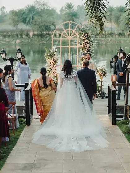 We love designing for venues where nature plays a leading role. For this lakeside vow ceremony, we created a simple, elegant floral arch that framed the couple beautifully, letting the serene water and golden light tell the rest of the story.