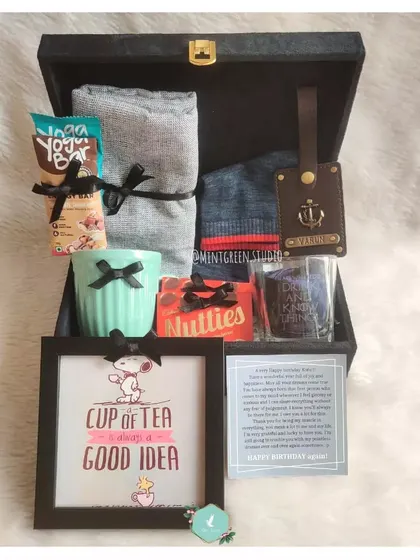 A birthday hamper that's both fun and practical. We included a cute "Cup of Tea" photo frame, a personalized luggage tag, a ceramic mug, and a handwritten note to make his day special.