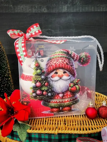 Santa decorations and festive fabric appear in our Christmas basket, with the gift presentation framed by small trees and ribbons.