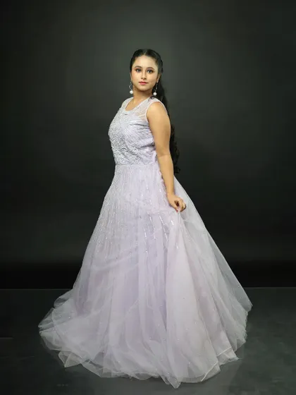 The gown from the side, showing its elegant profile and the way the tulle skirt falls.