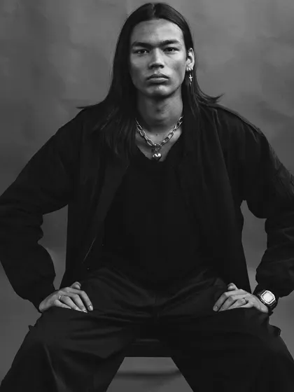 This is a raw, honest male portrait. The direct gaze, simple styling, and moody black and white tones come together to create an image that feels strong, authentic, and unapologetically real.