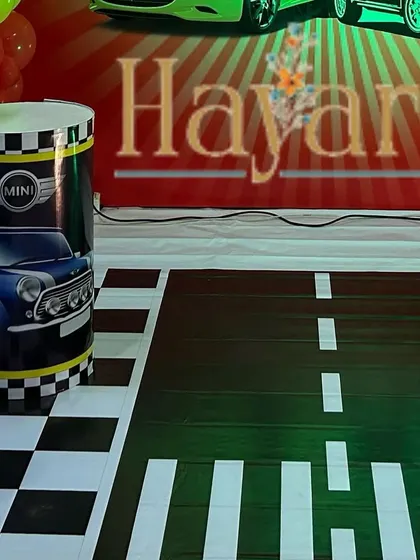 A custom floor mat designed to look like a road, adding to the immersive feel of the car theme.