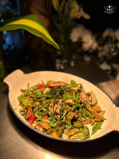 A colourful and healthy stir-fry, showcasing a mix of fresh vegetables like broccoli, baby corn, and bell peppers, all tossed in a light and flavourful sauce.