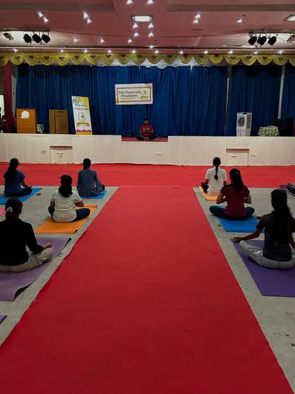 Leading the meditation from the stage at the Lila Poonawalla Foundation event. Creating a calm and focused environment is key, even in a large hall.