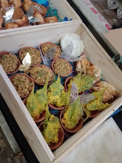 Another view of our platter box, this one showcasing our Palak Patta Chaat and Chana Masala. These boxes are a convenient way to enjoy our gourmet food at home.