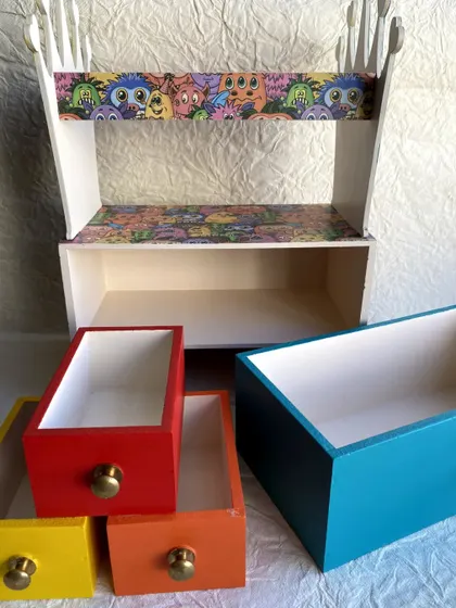 Here are the drawers and the main unit of the headband holder, showing the colorful, hand-painted compartments.