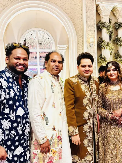 With my father and the happy couple at an engagement party. It's a joy to be a part of such special celebrations.