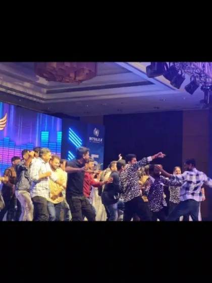 The team from Bitsilica dancing on stage, enjoying their anniversary party.