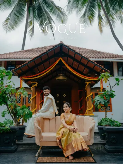 A 'Vogue'-inspired shot of the couple posing elegantly outside a resort-style venue, showcasing our premium photography style.