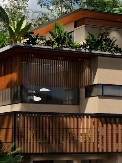 An alternate angle of the 18th Avenue House, highlighting the layered green roofs and deep overhangs that are crucial for passive cooling in Chennai's climate.