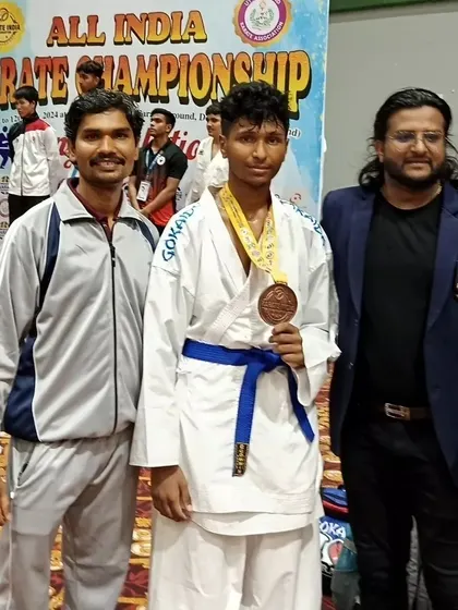 Posing with my national bronze medalist student, Neeraj B, at the All India Karate Championship. Guiding students to reach such heights is the greatest reward of a teacher.