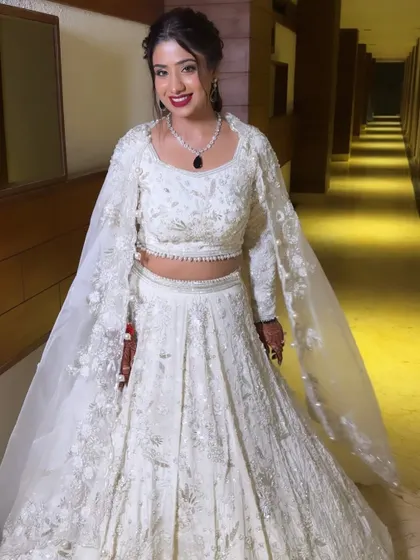 The full Sangeet look. Vaishali looks incredible, proving that a white lehenga can be just as impactful and bridal as any other color.