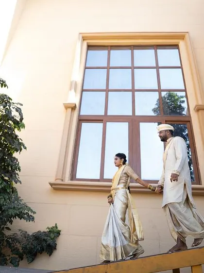 A wide shot that tells a story. The makeup ensures the bride looks flawless and radiant, even from a distance, tying the entire visual narrative of the photoshoot together.
