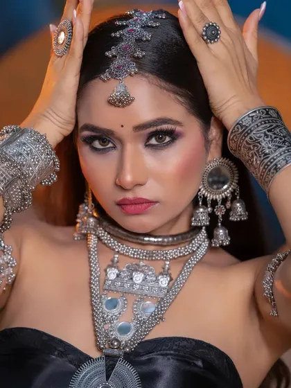 A powerful pose that highlights both the makeup and the stunning jewelry. I teach my students to direct models to get the best shots for their portfolios.