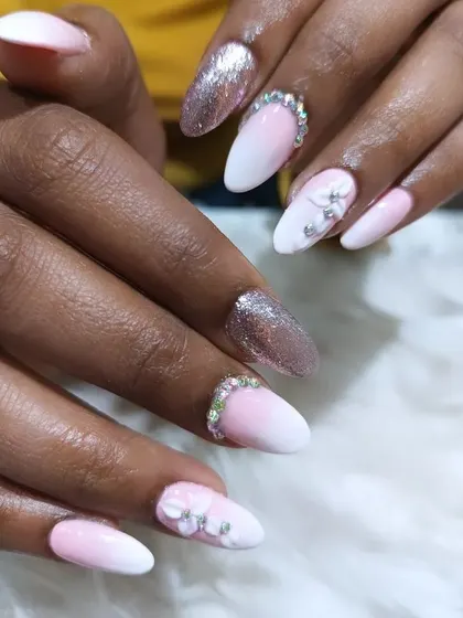 A glamorous bridal look combining a pink and white ombre, full-coverage rose gold glitter, and 3D floral and rhinestone accents.