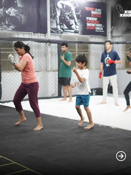 Our classes are for everyone. Here, you can see a mix of adults and kids learning shadowboxing and footwork together, creating a positive and inclusive training environment.
