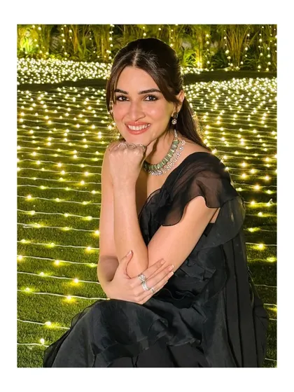Kriti Sanon looking serene and beautiful, adorned with my mint-green floral choker set against a backdrop of fairy lights.