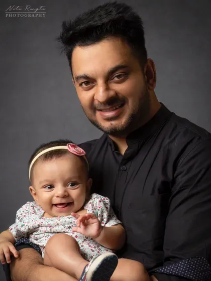 A father's first love. This portrait of a dad and his baby daughter captures the special bond they share with a simple, timeless look.