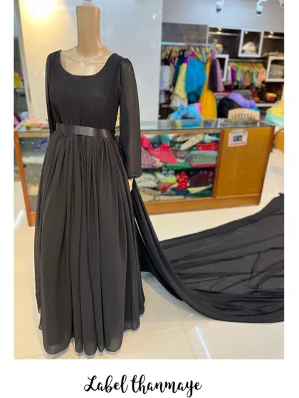Another view of the black gown, showing the full length of the dramatic trail.