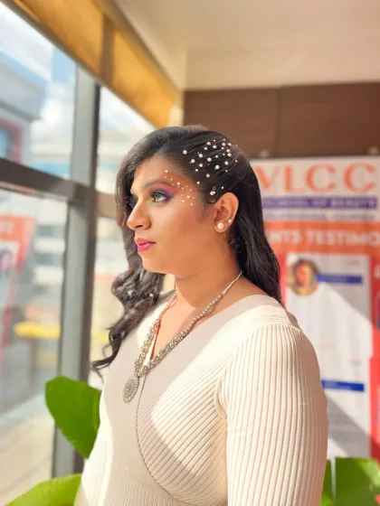 A subtle yet creative look with sparkling gems placed like constellations on the face, paired with colorful eyeshadow.