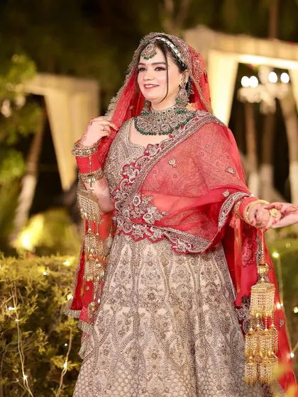 The bride making her entrance, her entire look coming together beautifully with the elegant lehenga and radiant makeup.