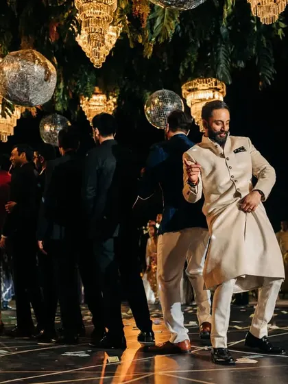 The groom and his friends lined up and ready to perform. The anticipation before a groomsmen dance is always electric.