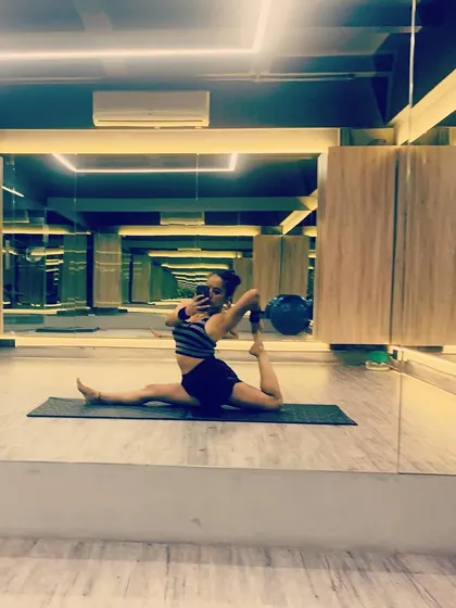 Happy weekend. A post-gym selfie in a split with a backbend. It's important to cool down and stretch after any intense physical activity.