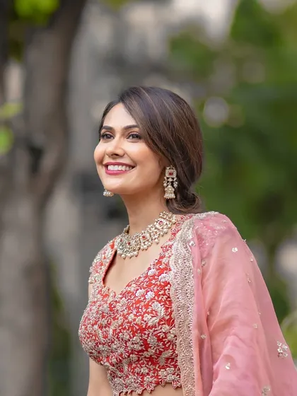 A joyful, candid shot. The makeup is designed to look great from all angles and in any light, whether it's a posed photo or a spontaneous moment.