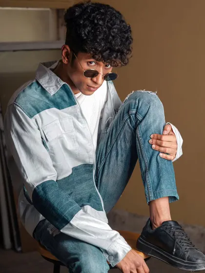 Another shot of the same model, this one with a more seated and contemplative pose, showcasing his style.