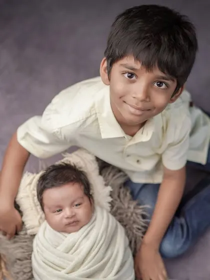 A big brother's proud smile. I love including siblings in my photoshoots to capture the beginning of their journey together.