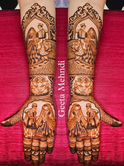 Capturing the beautiful varmala ceremony in henna. This symmetrical design shows the bride and groom exchanging garlands, a pivotal moment in any Indian wedding.